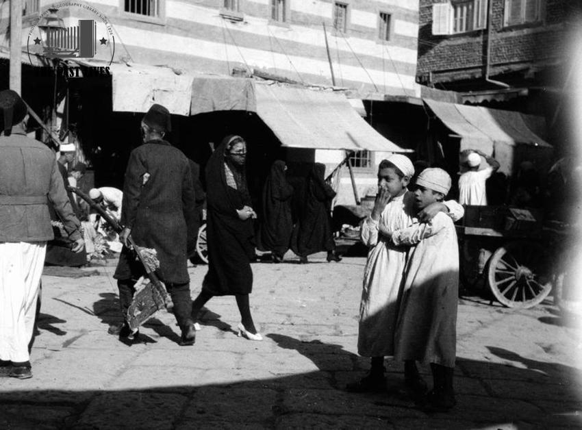 Upholsterer Walking Past a Mosque ,Alexandria, Egypt 1924