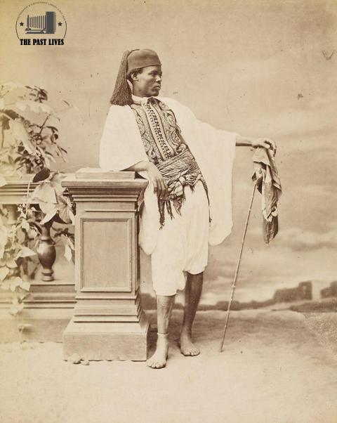 Egyptian groom in his beautiful costume and distinctive cane, 1872